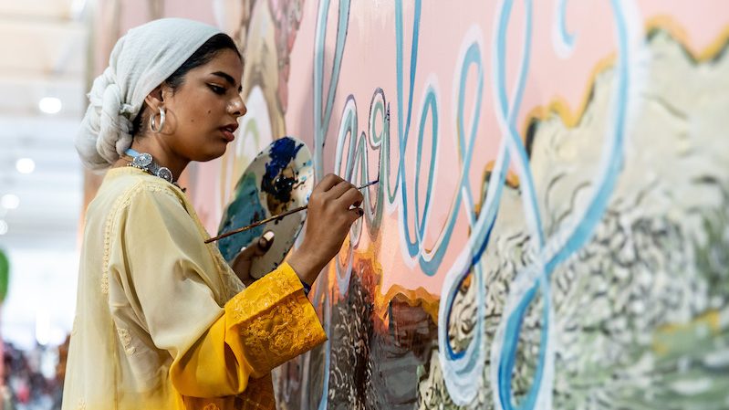 Young artists paint a wall at the Youth and Children Pavilion at Cop27 in Sharm El Sheikh, Egypt. A draft deal was published on Thursday