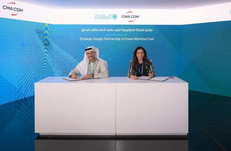 Mohammad Abdelqader El Ramahi, Masdar chief green hydrogen officer, and CMA CGM's Christine Cabau Woehrel sign the strategic supply partnership on green fuel