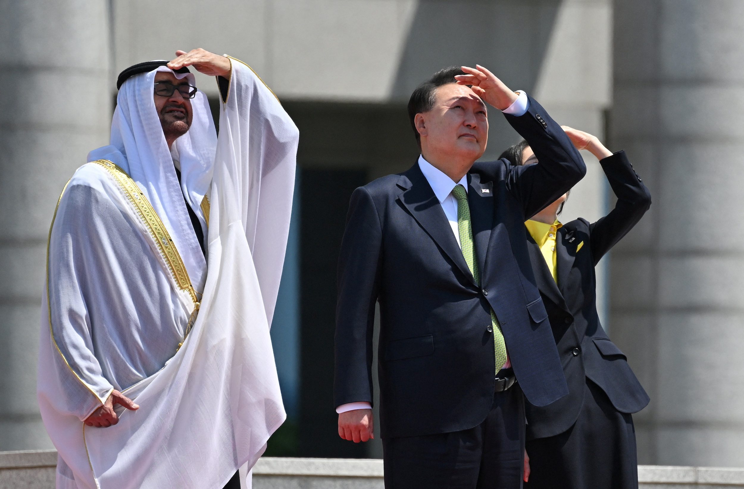 United Arab Emirates President Sheikh Mohamed bin Zayed Al Nahyan, South Korean President Yoon Suk Yeol and his wife Kim Keon Hee watch the Black Eagles, the aerobatic team of T-50 jets belonging to South Korea's air force, during a welcoming ceremony at the Presidential Office in Seoul on May 29, 2024. JUNG YEON-JE/Pool via REUTERS