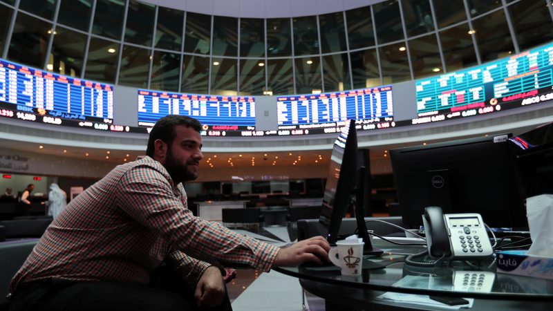 A trader looks at the screens at Bahrain Bourse in Manama, Bahrain, February 7, 2018. REUTERS/Hamad I Mohammed