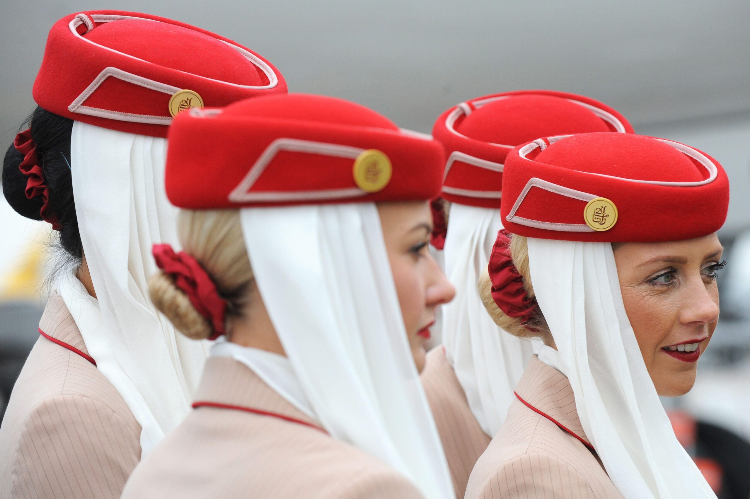 Emirates Airline cabin crew. The Investment Corporation of Dubai owns the airline and has a significant stake in Dubai's biggest bank Emirates NBD