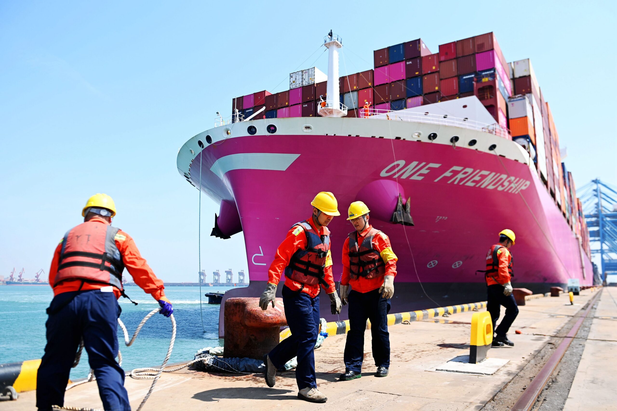 Dockworkers at China's Qingdao Port in Shandong province. The Middle East, Africa and Asia are forecast to propel global trade to $32.6 trillion by 2030