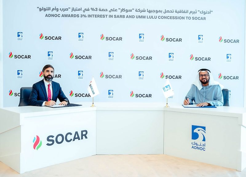 Socar president Rovshan Najaf and Adnoc upstream executive director Abdulmunim Saif Al Kindy sign the concession award