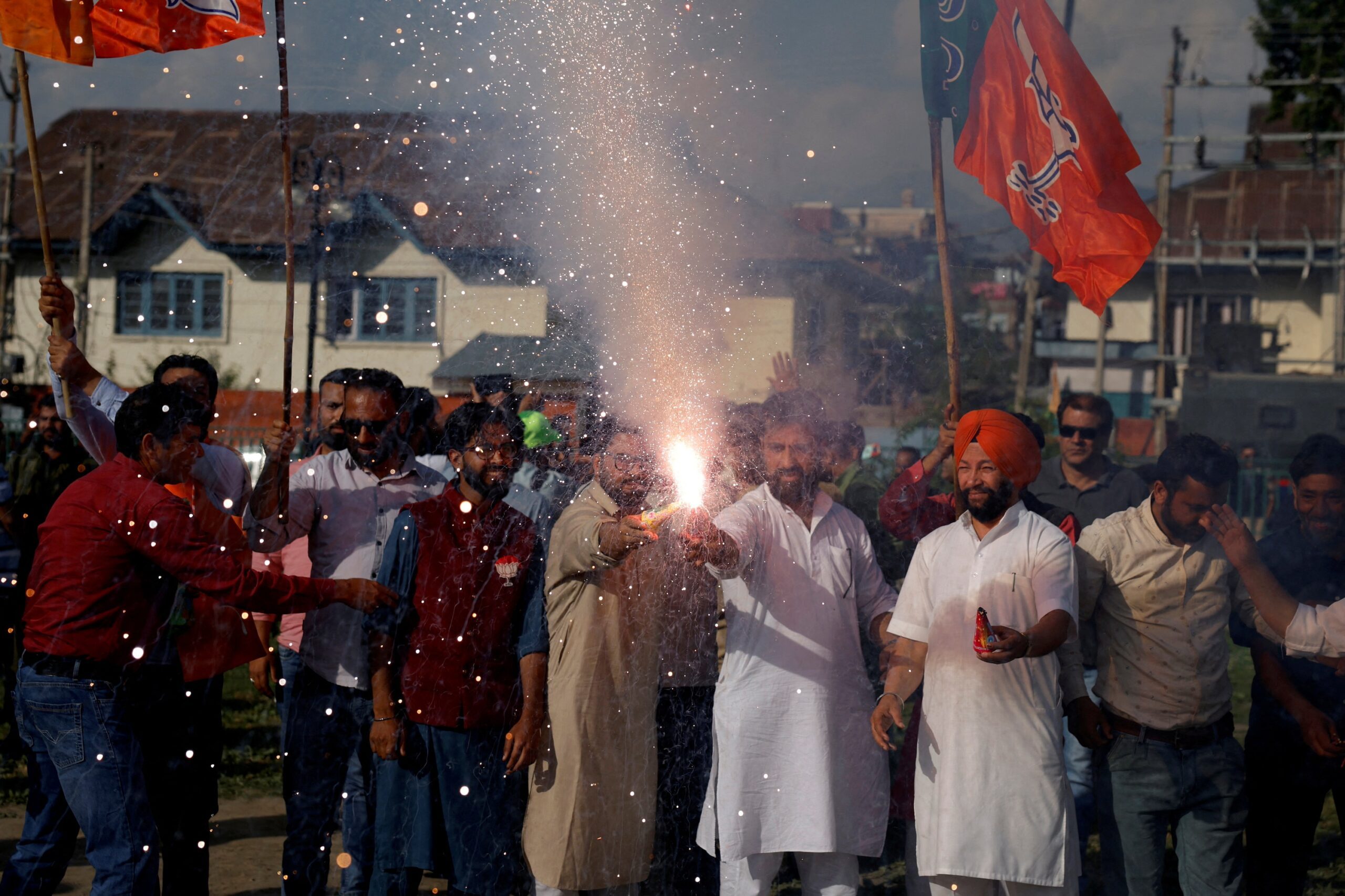Supporters of Narendra Modi's BJP light fireworks to celebrate the party's election results in Srinagar