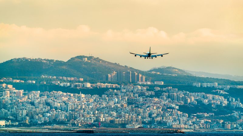 An airplane on final approach to Beirut International Airport: Lebanon has cut the amount owed to airlines by 9%