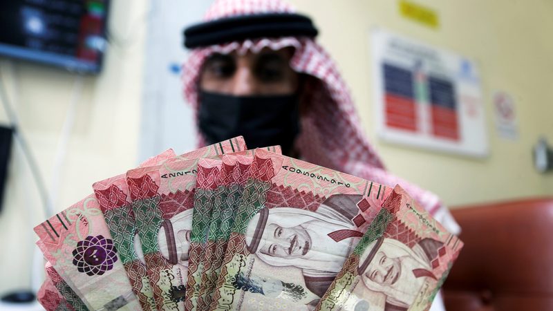 A worker at a currency exchange in Riyadh, Saudi Arabia. The IMF said central bank digital currencies will lower the cost of financial services