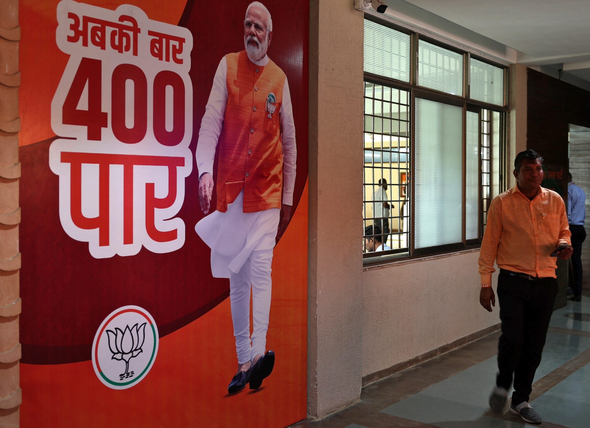 A BJP campaign poster at its Gujarat headquarters in Gandhinagar. The party and its partners in the NDA were aiming for more than 400 seats, but have fallen short