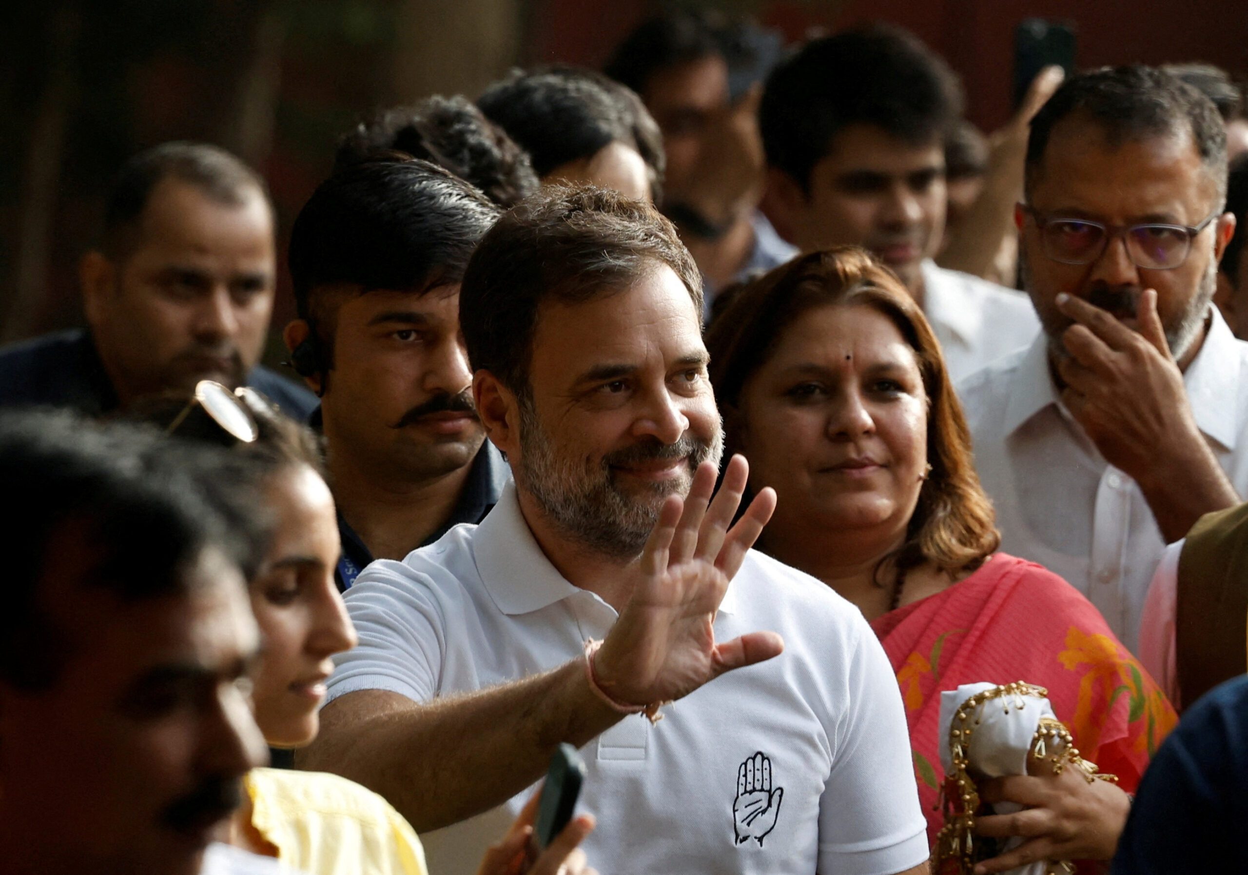 The Congress Party's Rahul Gandhi waves to supporters at its HQ in New Delhi. His opposition alliance has made big gains