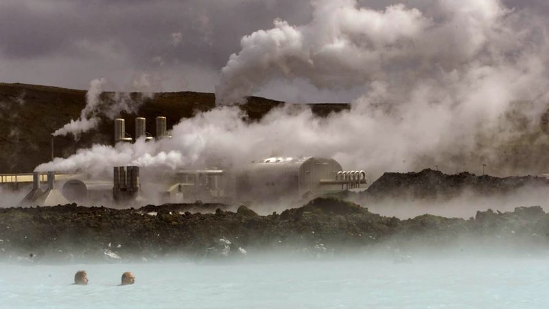 People swim in Iceland's Blue Lagoon hot spring in front of a geothermal power plant. Reykjavik Geothermal is working with Taqa in Saudi Arabia