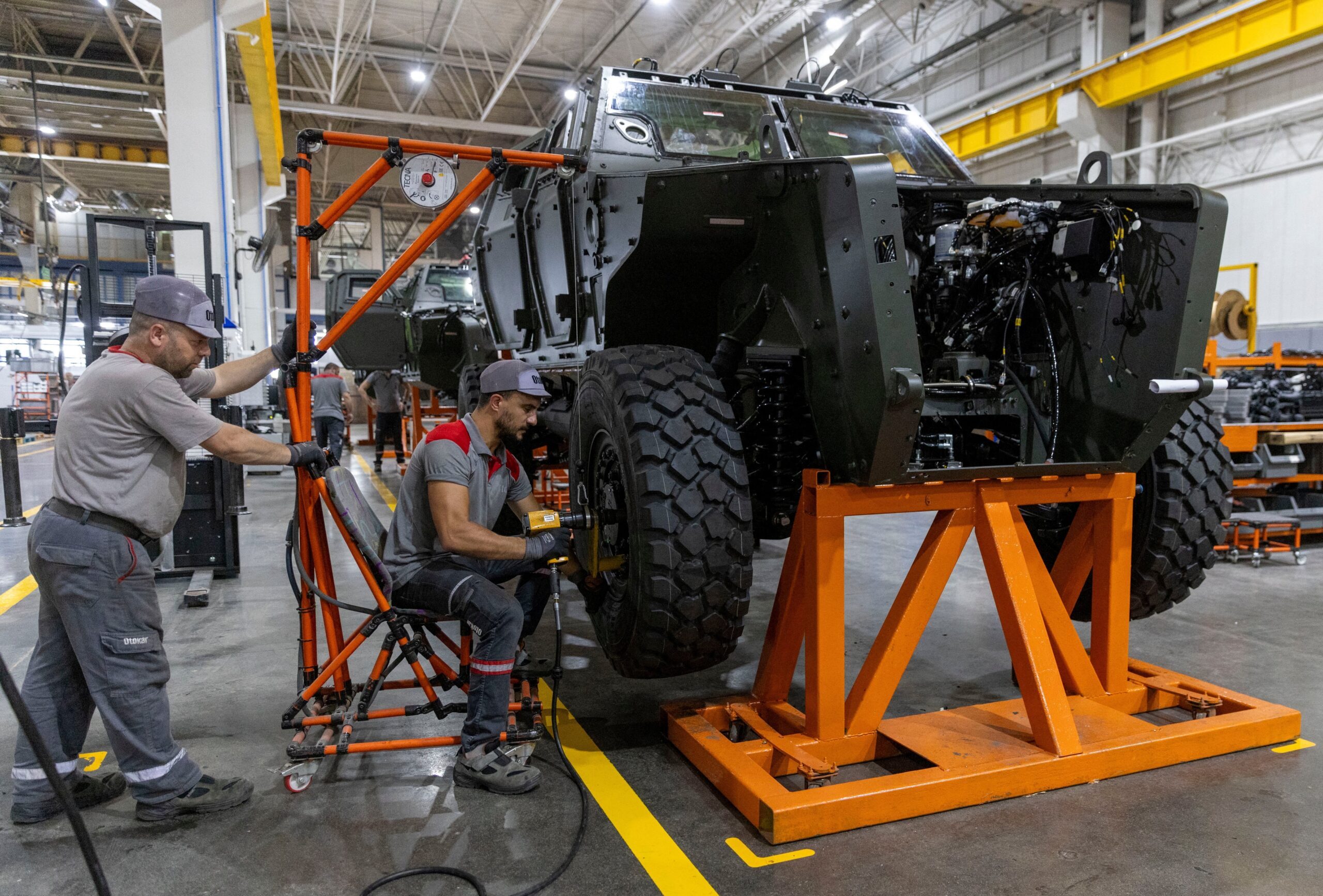 Technicians work on a military vehicle at the Otokar factory in Arifiye. Industrial production fell sharply in April