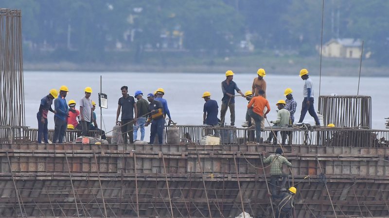 Workers are working on the construction of a bridge over the Brahmaputra River in Guwahati, India, on July 23, 2024. Indian Finance Minister Nirmala Sitharaman is presenting her seventh consecutive Budget today. (Photo by Anuwar Hazarika/NurPhoto)NO USE FRANCE