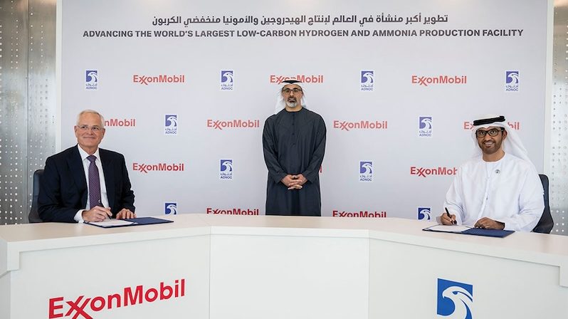 ExxonMobil chairman Darren Woods and Adnoc Group CEO Sultan Ahmed Al Jaber sign the agreement in the presence of Abu Dhabi crown prince Sheikh Khaled bin Mohamed bin Zayed Al Nahyan