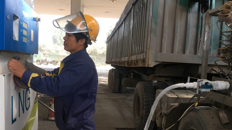 A driver fuels his truck with liquefied natural gas in China's Hebei province. Approximately 30% of trucks sold in China run on natural gas