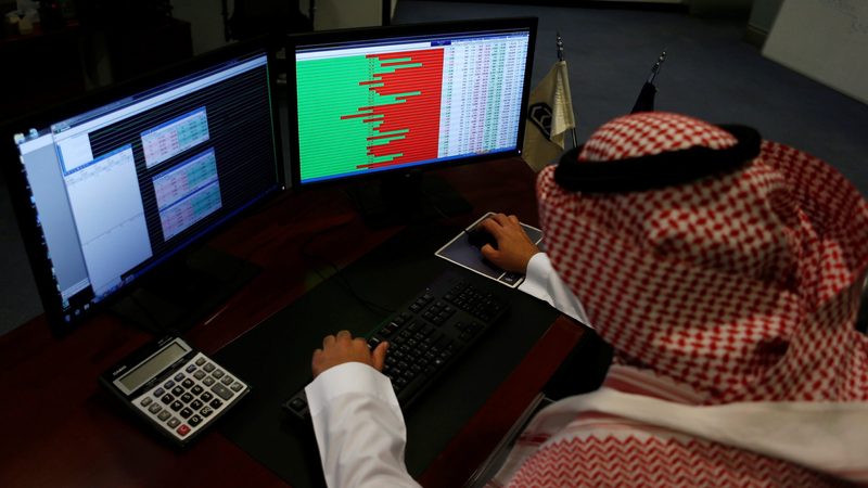 A Saudi trader observes the stock market. eXtra, the parent company of United International Holding Company, listed in 2011