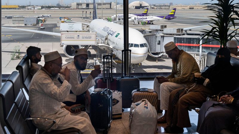 Passengers and a Saudia jet at Jeddah airport. The Jeddah-Riyadh route is the sixth most popular domestic airline route in the world