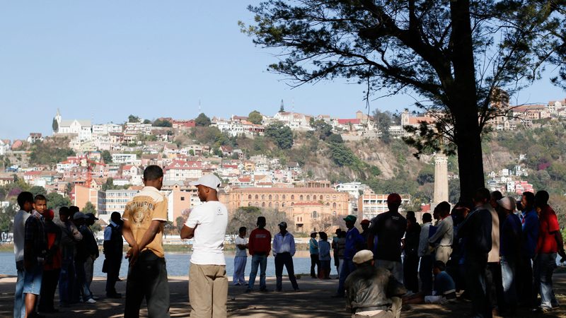 Locals playing boules by Lake Anosy in the centre of Antananarivo. Madagascar.Madagascar.