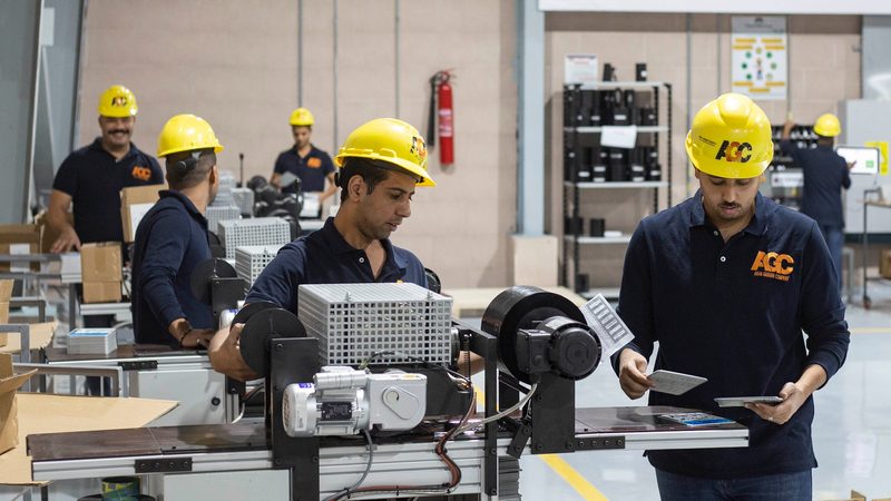 Workers manufacture vehicle registration plates in Cairo, Egypt. September's PMI data showed a renewed decline across the Egyptian non-oil private sector