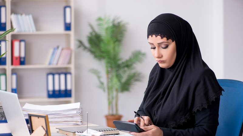 W107M0 Female employee bookkeeper in hijab working in the office The central bank said there was a 7 percent year-on-year growth for personal loans, while business lending grew 16 percent