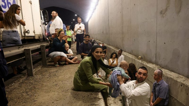 Israelis take shelter during Iran's missile attack. Oil prices have jumped over fears of a wider war