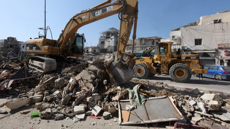 An excavator operates in Sidon, Lebanon. Local observers believe the Middle East should take the lead in rebuilding