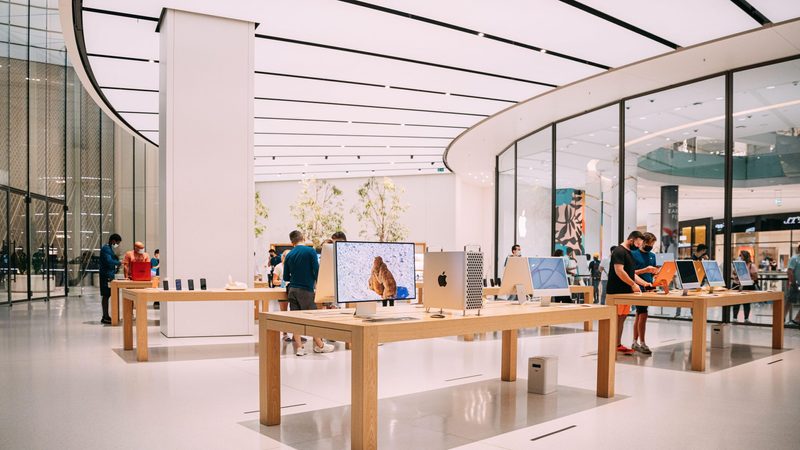 Shoppers look at Apple electronics in a Dubai store. Its phone and laptop sales are down in the Gulf