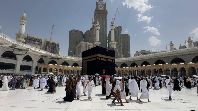 Muslim Pilgrims at The Kaaba in The Haram Mosque of Mecca , Saudi Arabia, In the morning performing umrah