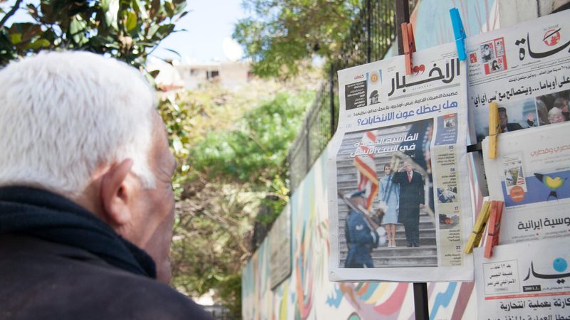 A stand in Beirut displays Arabic newspapers featuring the inauguration of President Donald Trump in 2017. The Arab world has generally welcomed Trump's return to the White House