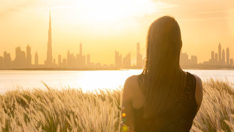 Dubai expat woman with city in baackground