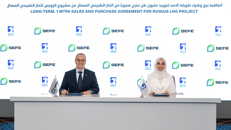 Sefe CEO Dr Egbert Laege and Adnoc executive vice president Fatema Al Nuaimi sign the long-term LNG supply deal