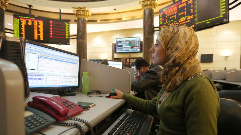 A trader works at the Egyptian Exchange. The rally on Egypt's bourse may continue if company valuations remain cheap