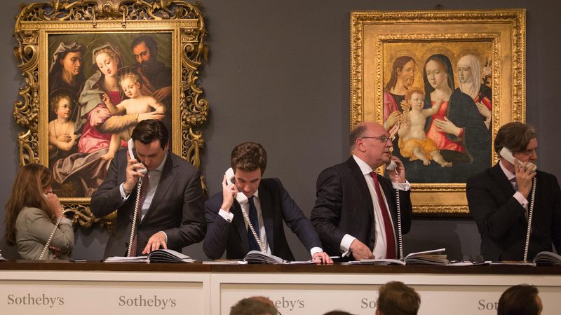 Sales agents taking bids at a Sotheby's auction in London. The 2025 auction will mark the opening of the company's Riyadh office