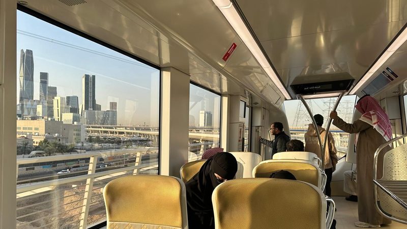 Passengers on a yellow line train to King Khalid airport. The Riyadh Metro offers passengers remarkable views of the city