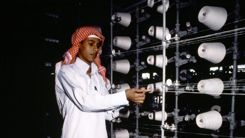 PMI november Saudi man in textile factory