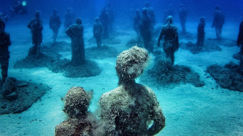 Crossing the Rubicon" underwater sculpture by artist Jason deCaires Taylor in the Museo Atlantico underwater museum off Playa Blanca, Spain. underwater marine museum