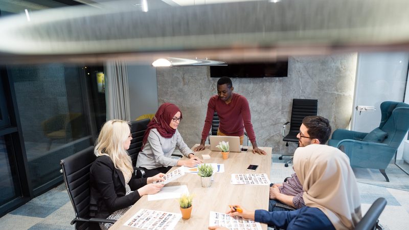 Startup business people group working everyday job at modern office. Tech office, tech company, tech startup, tech team.