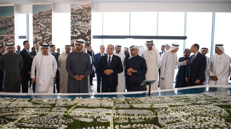 The presidents of the UAE and Egypt, Sheikh Mohamed bin Zayed Al Nahyan and Abdel Fattah El Sisi, look at models for Ras El Hekma