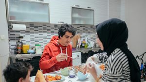 A family dinner at home. Kuwait's planned mortgage law is expected to increase homeownership