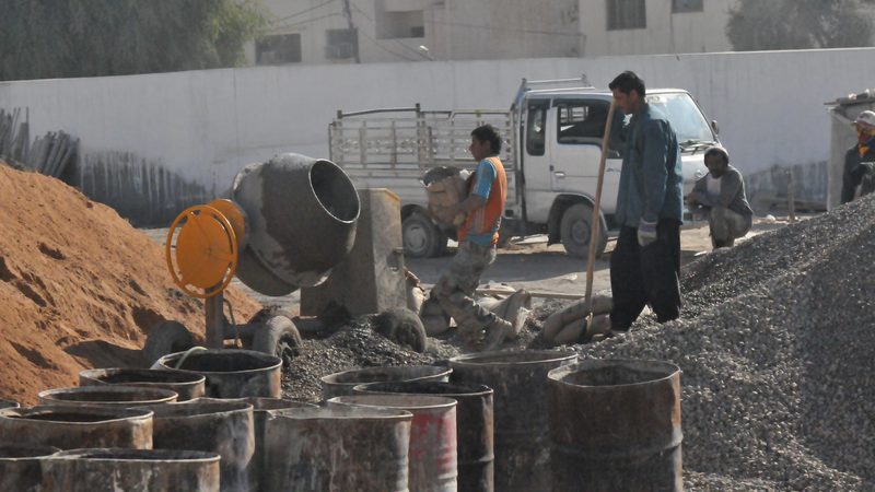 Workers building a secondary school in Baghdad. Construction is one of the sectors driving an increase in Iraq's non-oil revenues