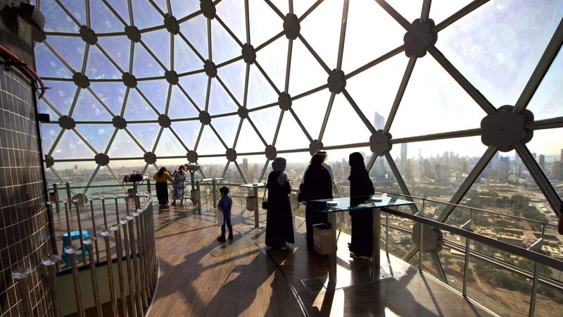 Visitors to Kuwait Towers look out over the city. Kuwait is Opec’s fifth-largest oil producer