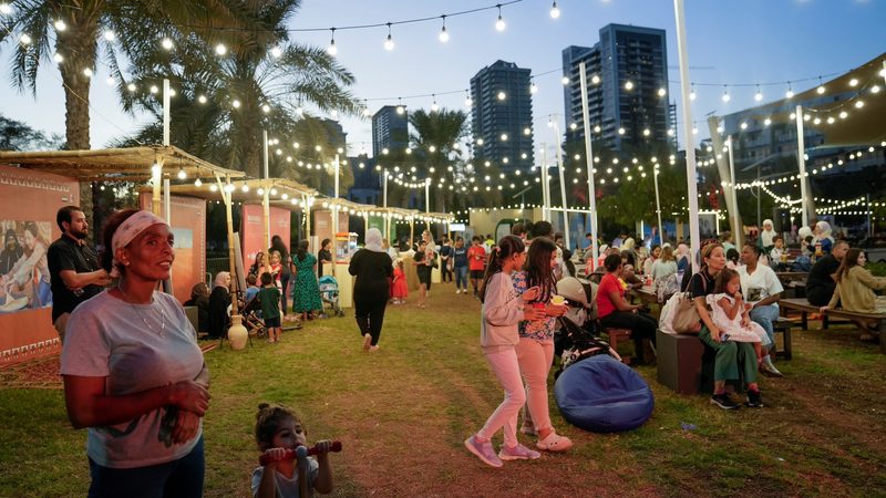 People take part in UAE National Day festivities at the Castle Park, Jumeirah Village Circle in Dubai