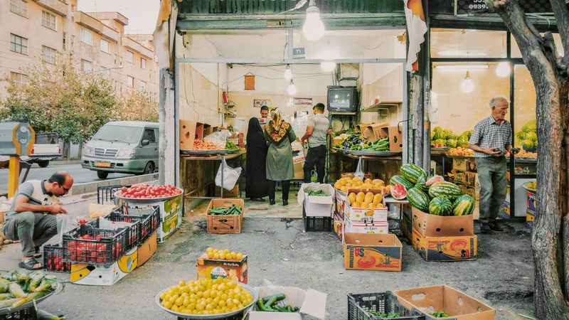 Shoppers at a market in Iran. Vegetables and legumes recorded inflation of 12.5 percent