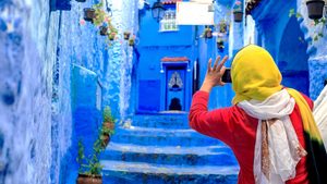 A tourist takes pictures in Chefchaouen, northern Morocco. The country's tourism startup culture is opening new markets beyond the traditional centres