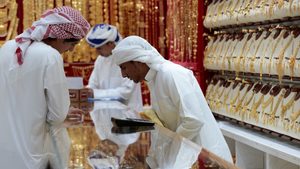 Men look at jewellery in the gold souk, Dubai. An unprecedented amount of gold has been sent from Dubai and other markets to New York in recent days in response to tariffs