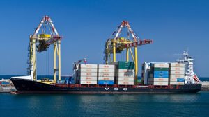 A container ship in the port city of Muscat, Oman