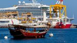 A traditional dhow and a cruise ship in Muscat. Crude oil exports make up 70% of Oman's revenue