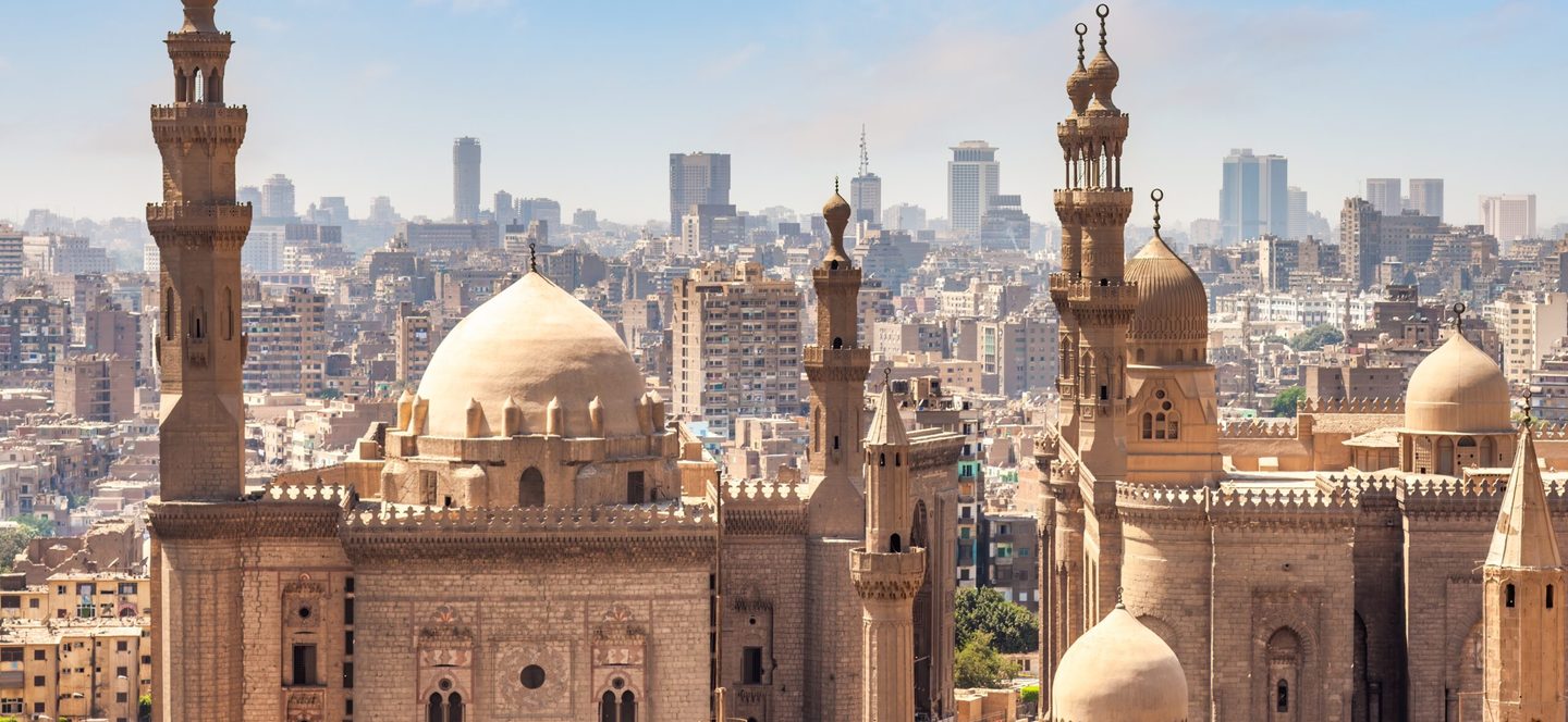 Aerial view of Cairo, Egypt skyline on a hazy day, in front of Mosque Madrasa Sultan Hassan and Al Rifai mosque