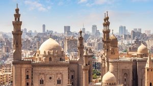 Aerial view of Cairo, Egypt skyline on a hazy day, in front of Mosque Madrasa Sultan Hassan and Al Rifai mosque