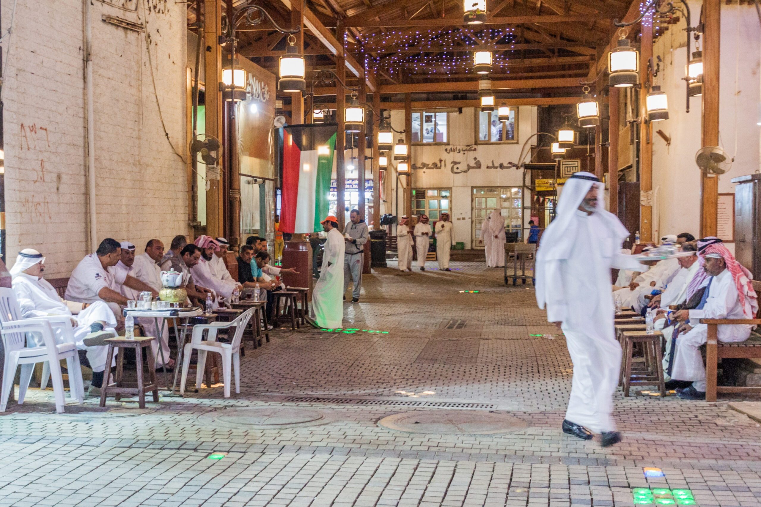 Men at the Kuwait City souq. Kuwait last sold dollar-denominated bonds in 2017