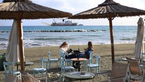 Two women relax in a waterfront cafe during the day in the Mediterranean port of Limassol. Cyprus, Tuesday, January 9, 2024. (Photo by Danil Shamkin/NurPhoto)NO USE FRANCE