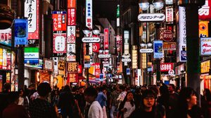 A busy Tokyo street full of neon signs and people. The Japan External Trade Organization (Jetro) said in its annual report this week that exports from the GCC totalled $84 billion in 2024